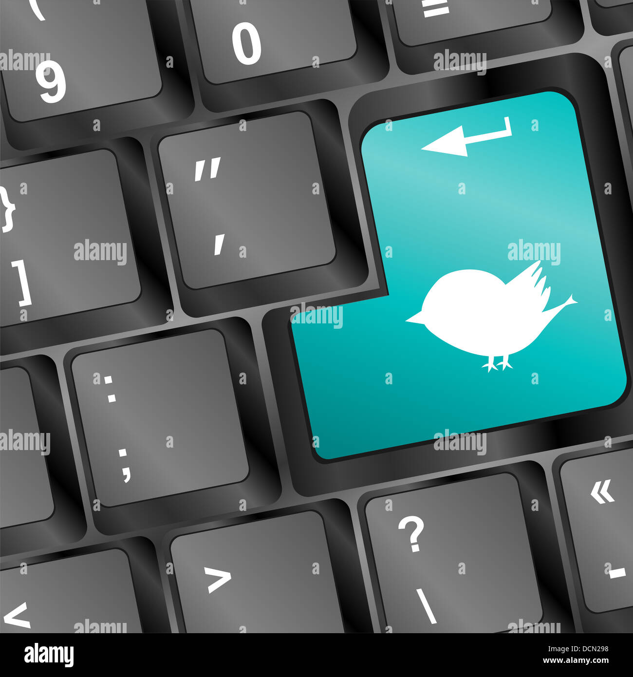 white bird silhouette on computer pc keyboard Stock Photo