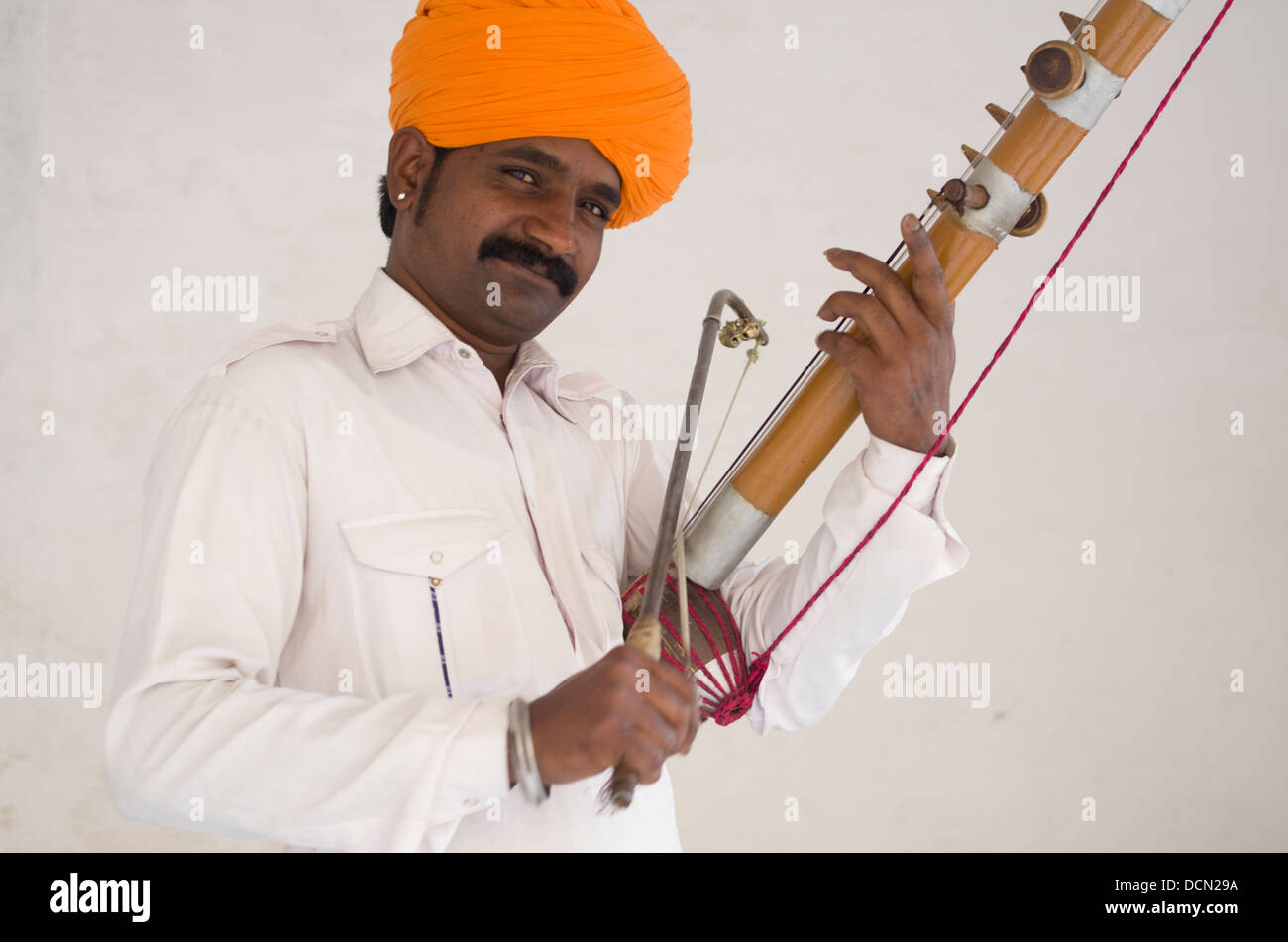 Indian Man with traditional stringed instrument Jodhpur, Rajashtan