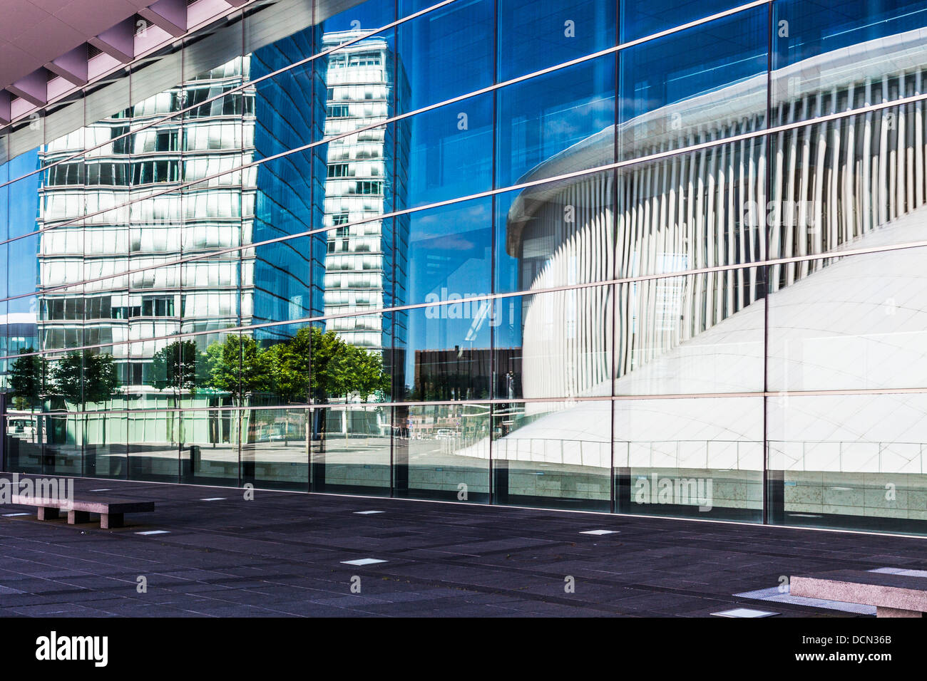 The Philharmonie concert hall and office buildings reflected in the European Conference & Congress Centre in Luxembourg City. Stock Photo