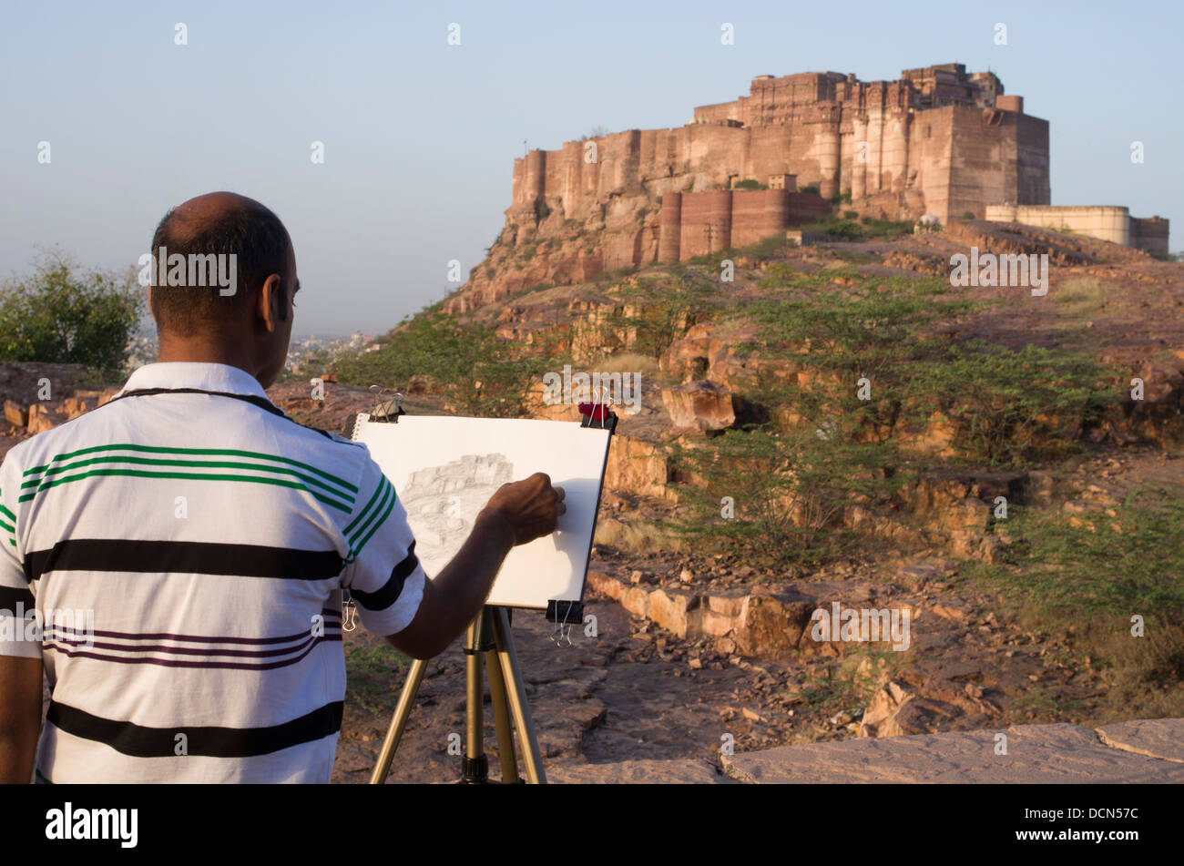 Indian man sketching Meherangarh Fort - Jodhpur, Rajashtan, India Stock Photo