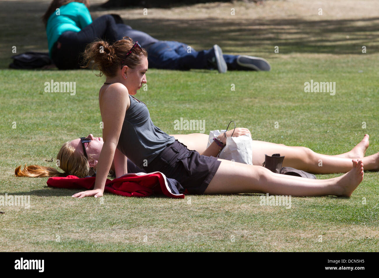 Hyde Park, London, UK. 20th August 2013. People sunbathing in Hyde Park as Londoners enjoy the sunshine and warm weather in the capital Credit:  amer ghazzal/Alamy Live News Stock Photo