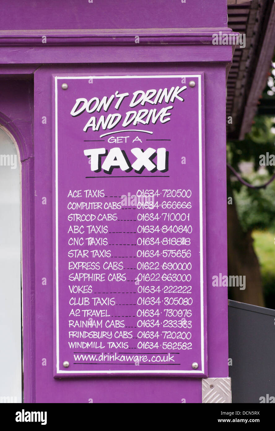 Advertisement On A Pub Wall Against Drink Driving with Taxi Telephone