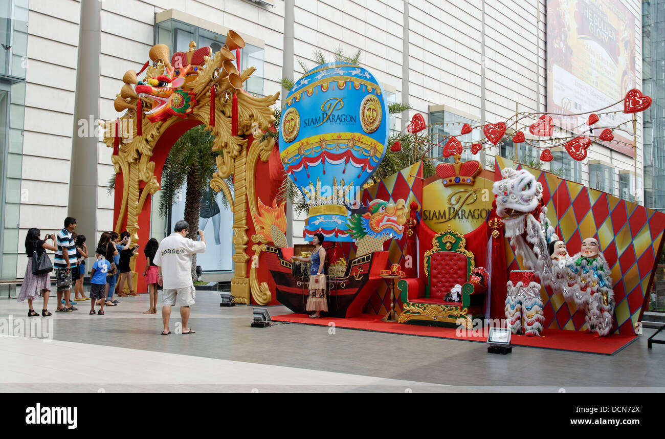 People taking photographs by a dragon display and throne, Chinese New Year in Bangkok, Thailand Stock Photo