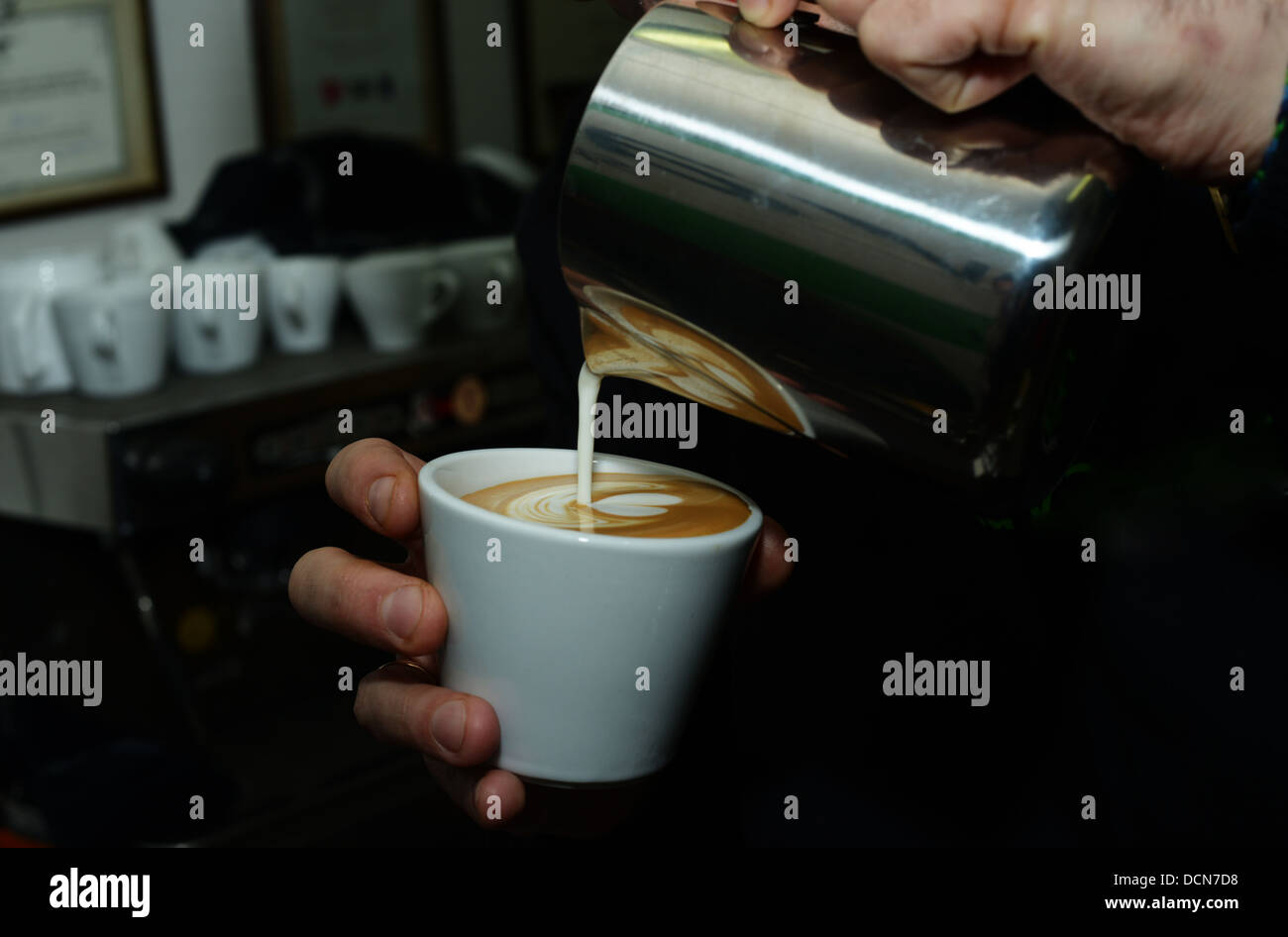 Latte-Art in process Stock Photo