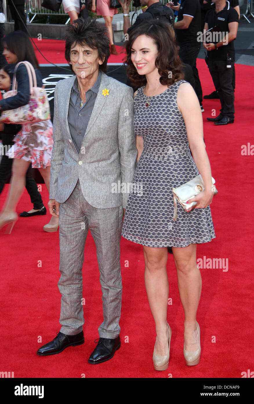London, UK, 20th August 2013. Ronnie Wood and Sally Wood attend the World Premiere of 'One Direction: This Is Us' at Empire Leicester Square Credit:  WFPA/Alamy Live News Stock Photo