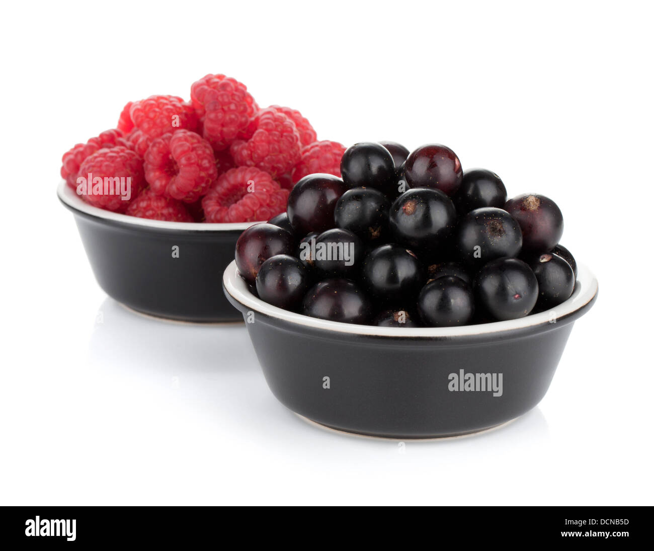 Black currant and raspberry. Isolated on white background Stock Photo ...