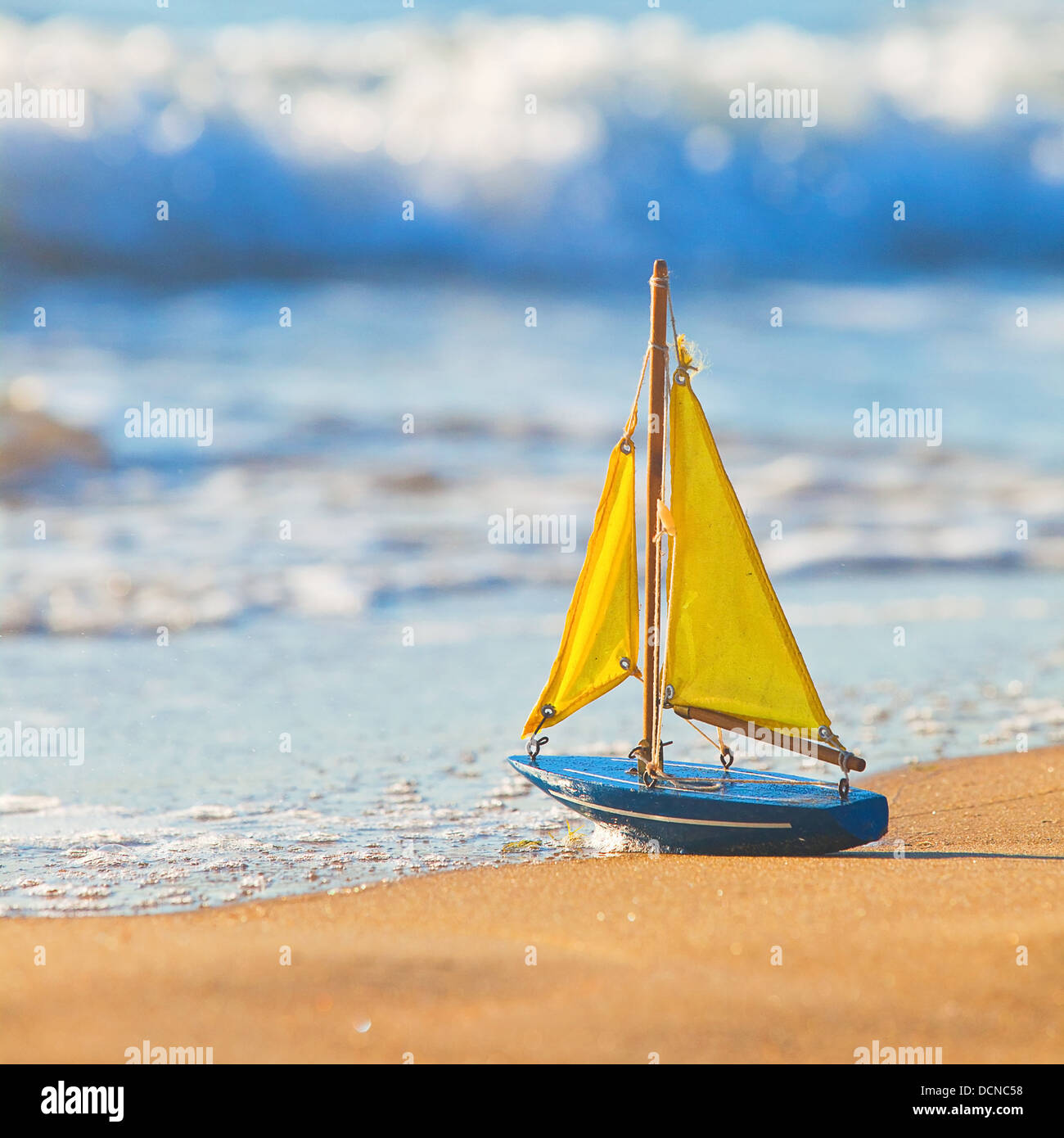 Toy sailing boat on beach hi res stock photography and images Alamy
