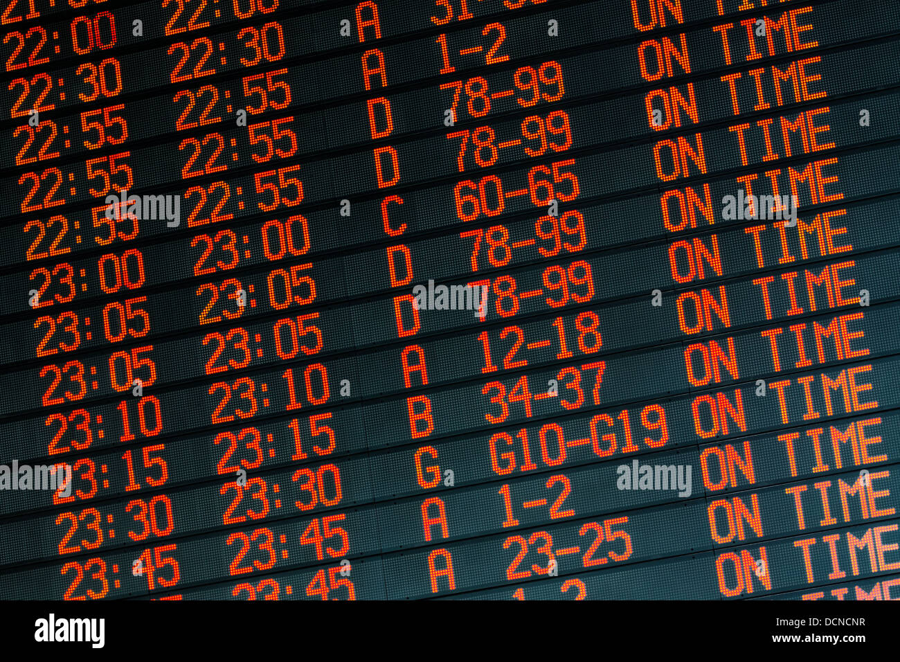 Orange led timetable - on time departures from international airport Stock Photo