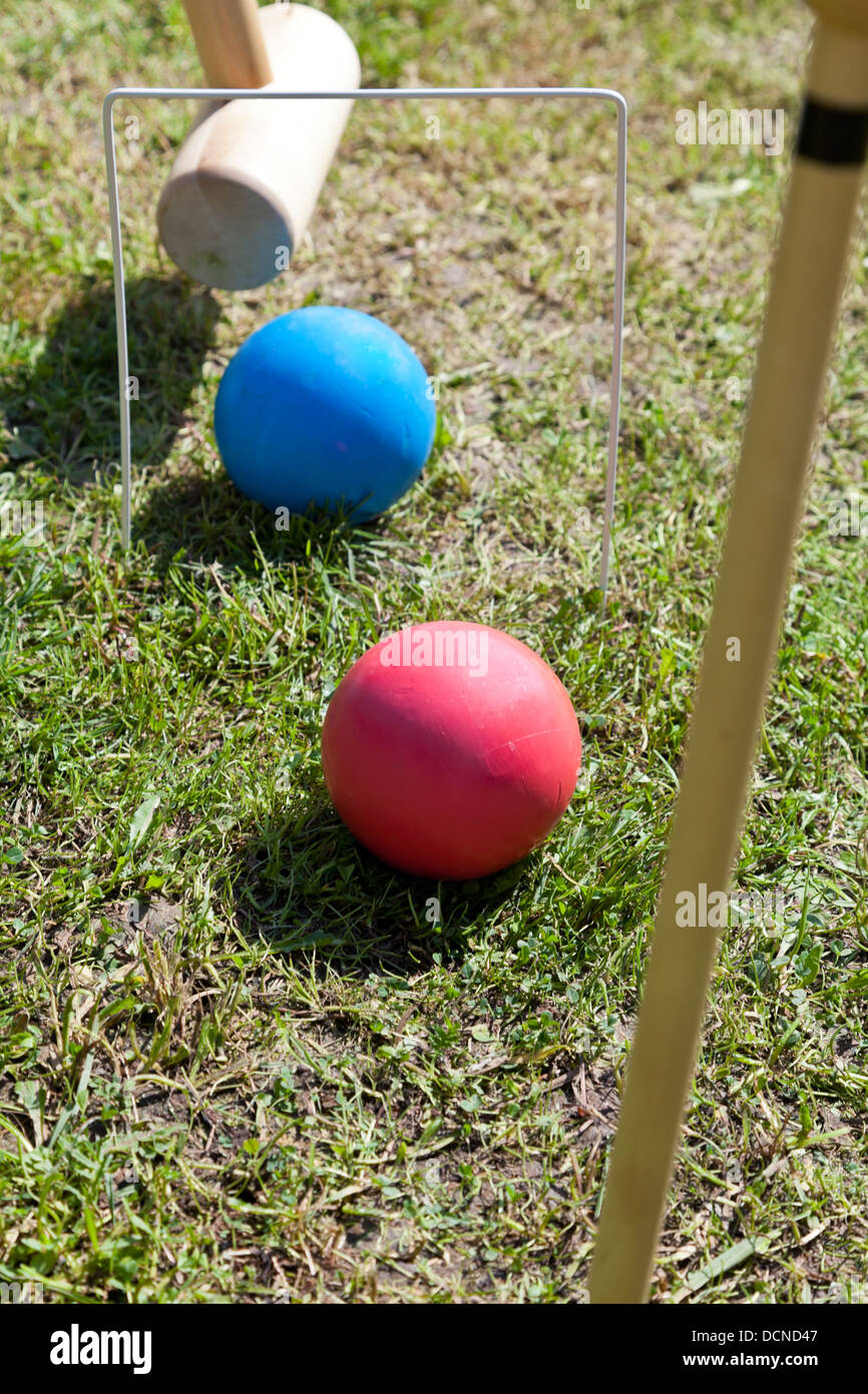 blue and red balls in game of croquet on green lawn Stock Photo Alamy