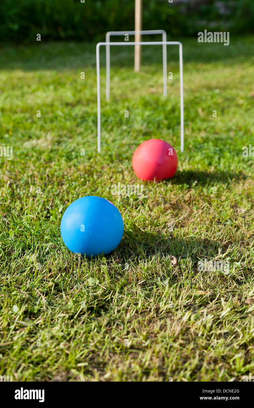 blue and red balls in game of croquet on green lawn in summer day Stock  Photo - Alamy