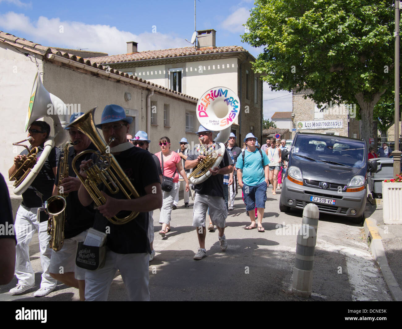 A French marching band called Delirium Tremens plays in a Languedoc village in France Stock Photo