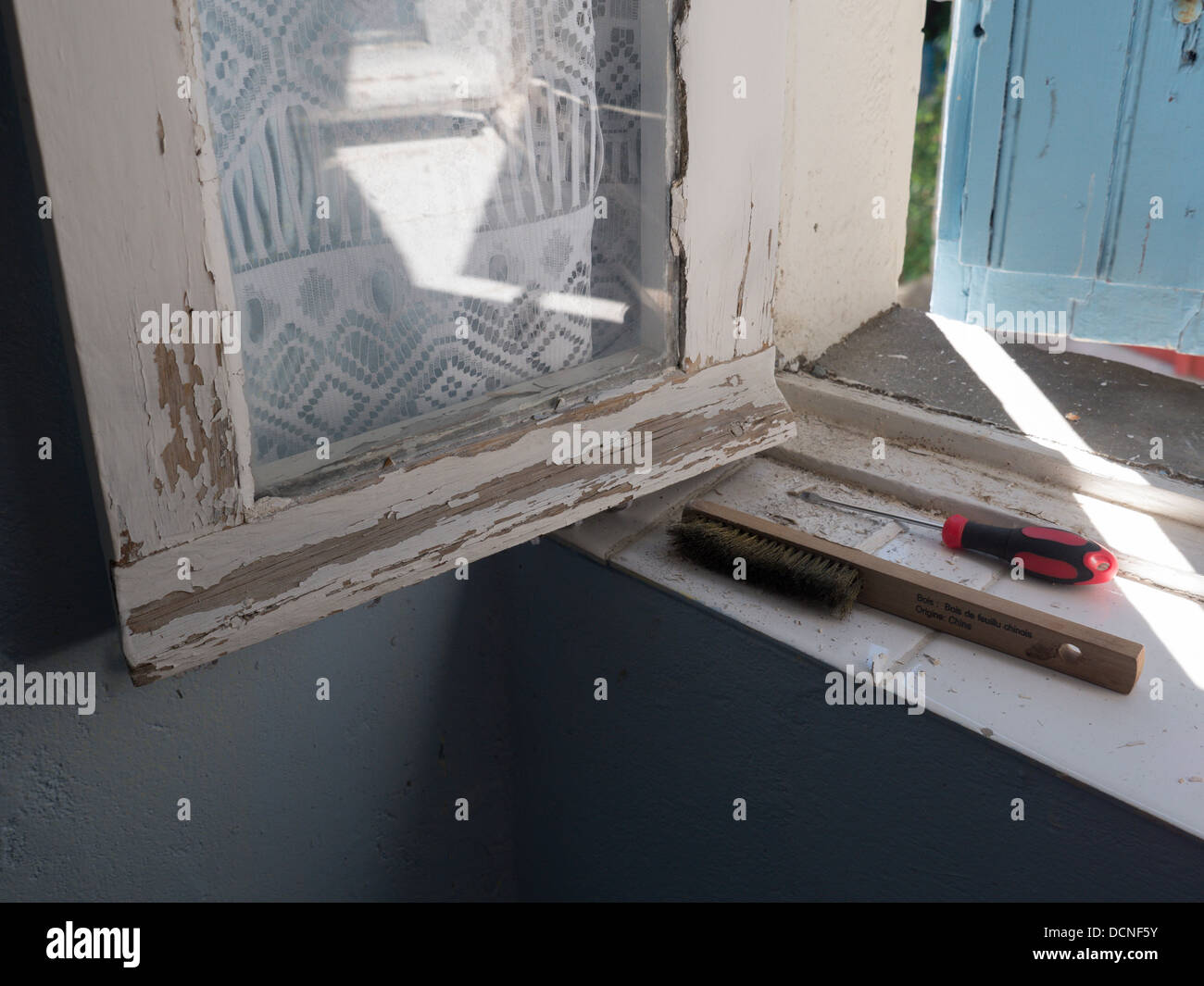 A weather worn window in an old house in BellegardeduRazes Languedoc