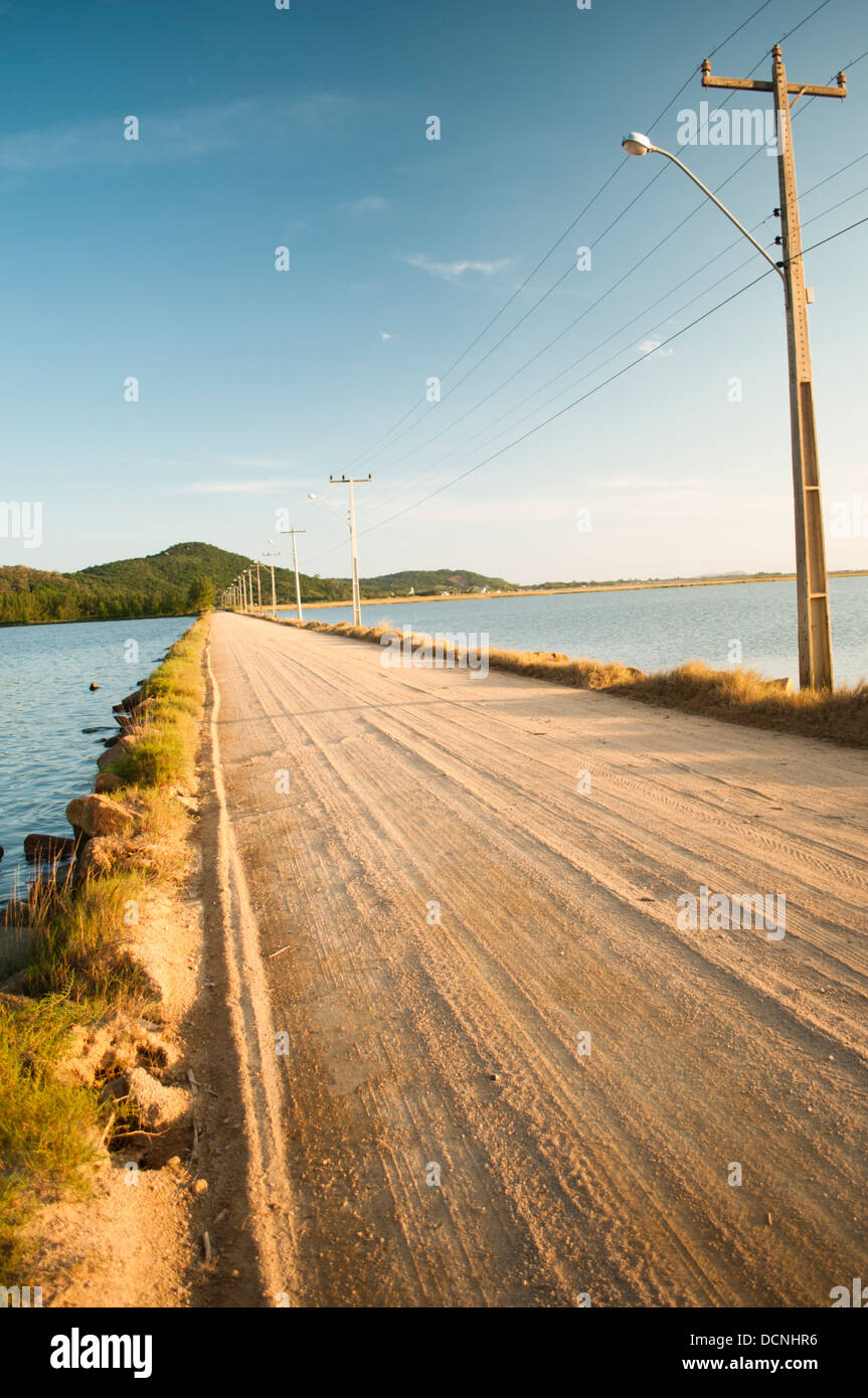 sand road crossing the lake from Laguna to Farol de Santa Marta, Santa Catarina state shore, south Brazil Stock Photo