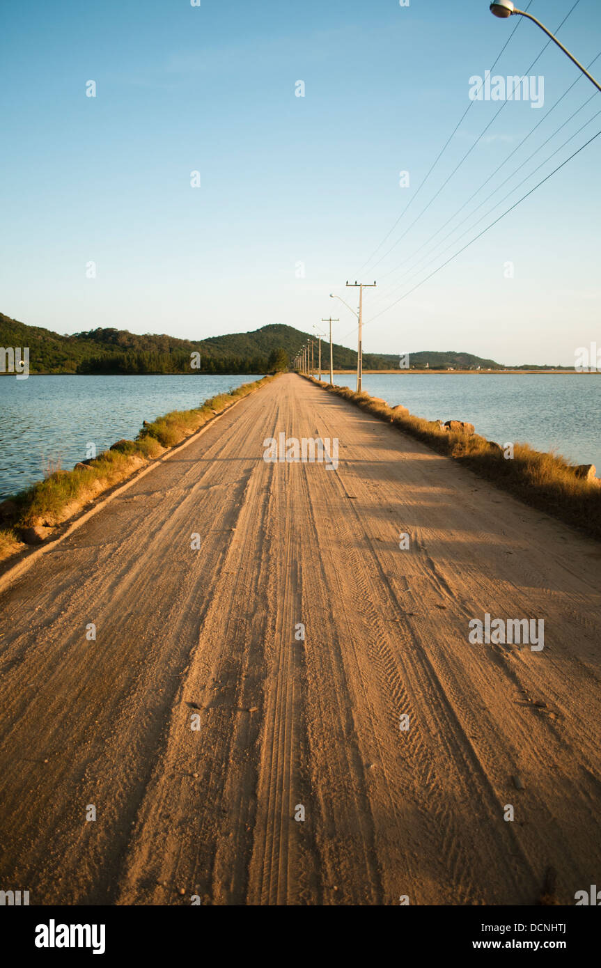 sand road crossing the lake from Laguna to Farol de Santa Marta, Santa Catarina state shore, south Brazil Stock Photo