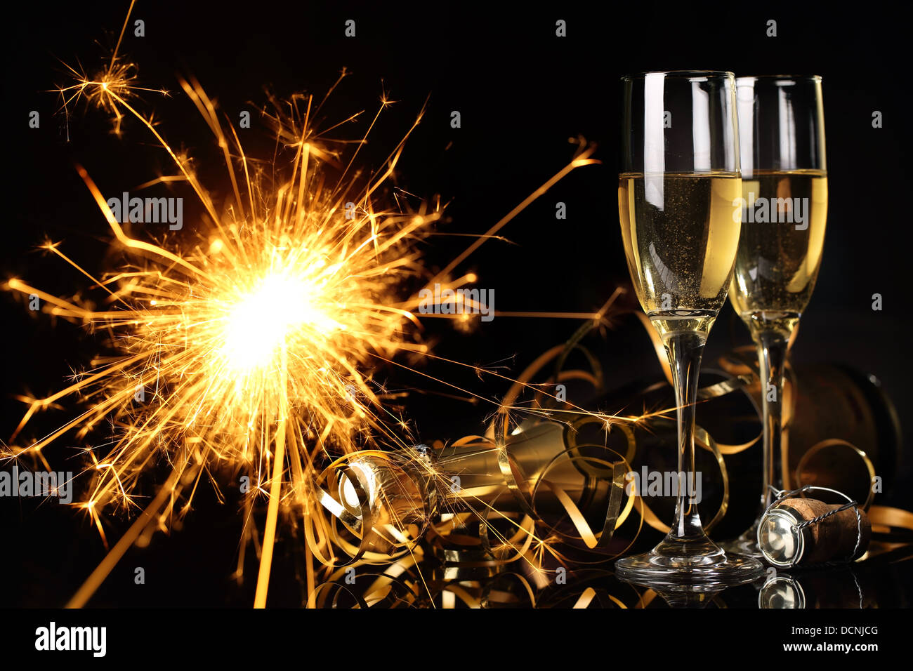 https://c8.alamy.com/comp/DCNJCG/glasses-of-champagne-and-fireworks-DCNJCG.jpg