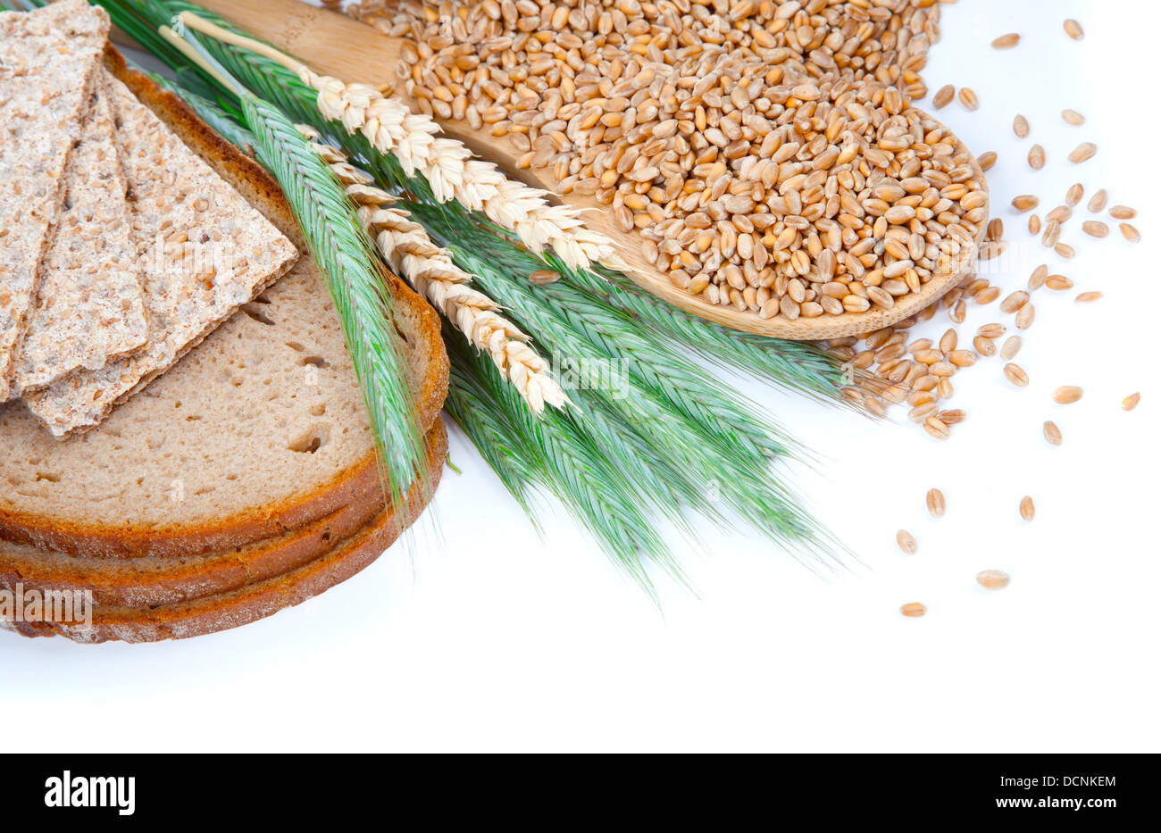 tasty baked bread with ears and wheat grain, isolated on a white Stock ...