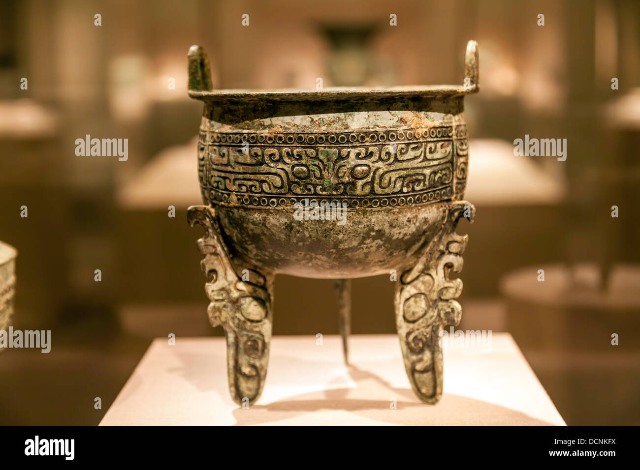 Bronze ritual food container, Ding, Shang dynasty, 15th-14th century B.C. with flat legs and scalloped profile. Stock Photo