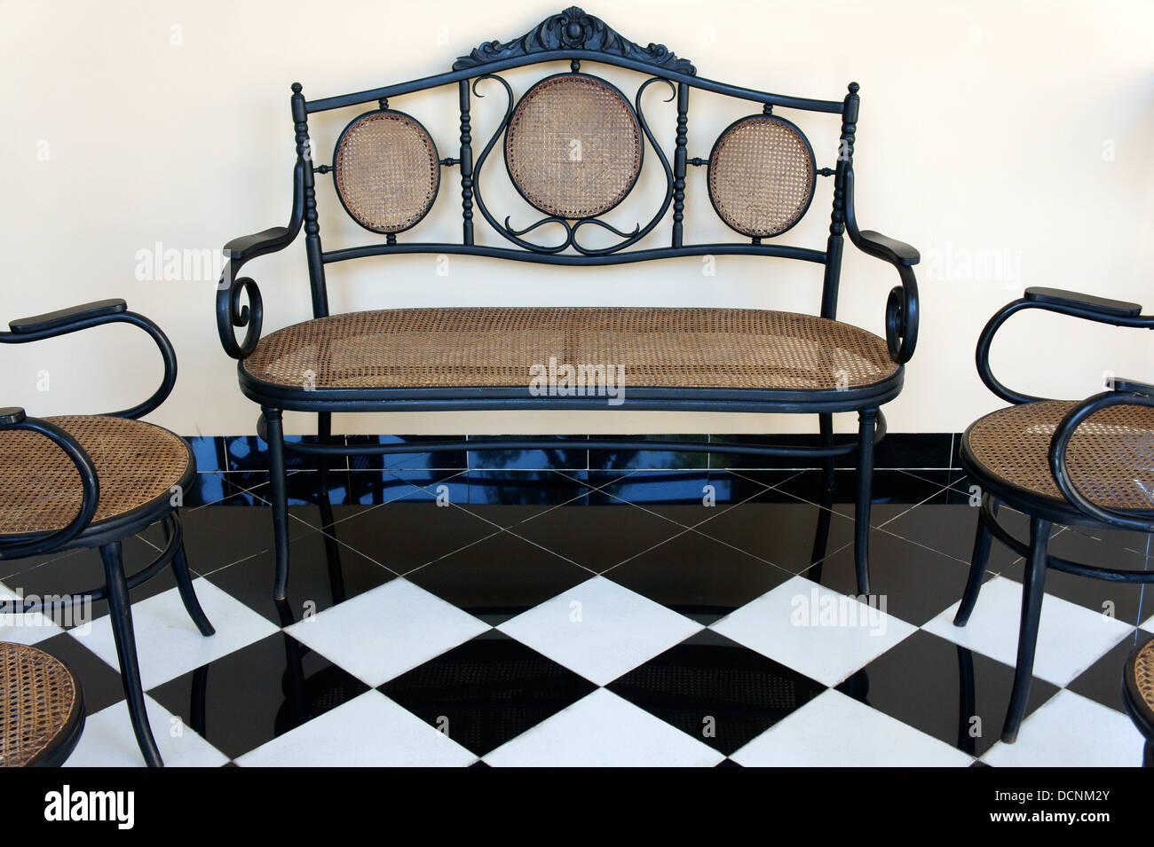 Ornate metal and wicker furniture in the Mansion Merida hotel, Merida