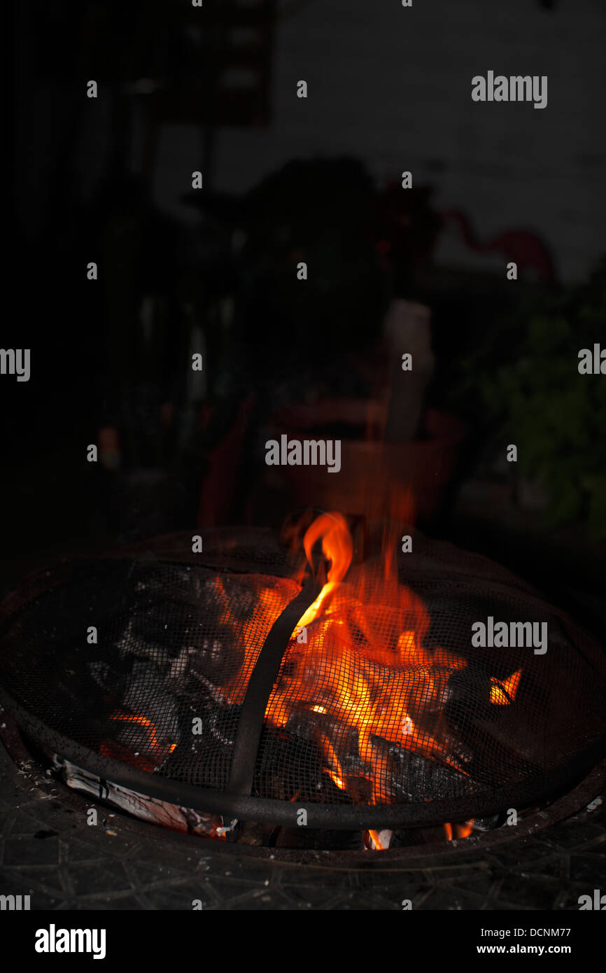 Outdoor fire pit at night Stock Photo Alamy