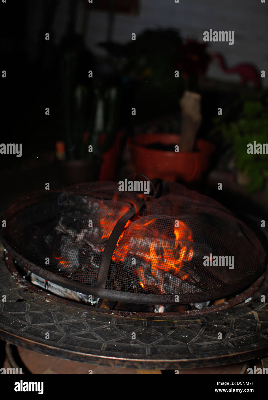 Outdoor fire pit at night Stock Photo Alamy