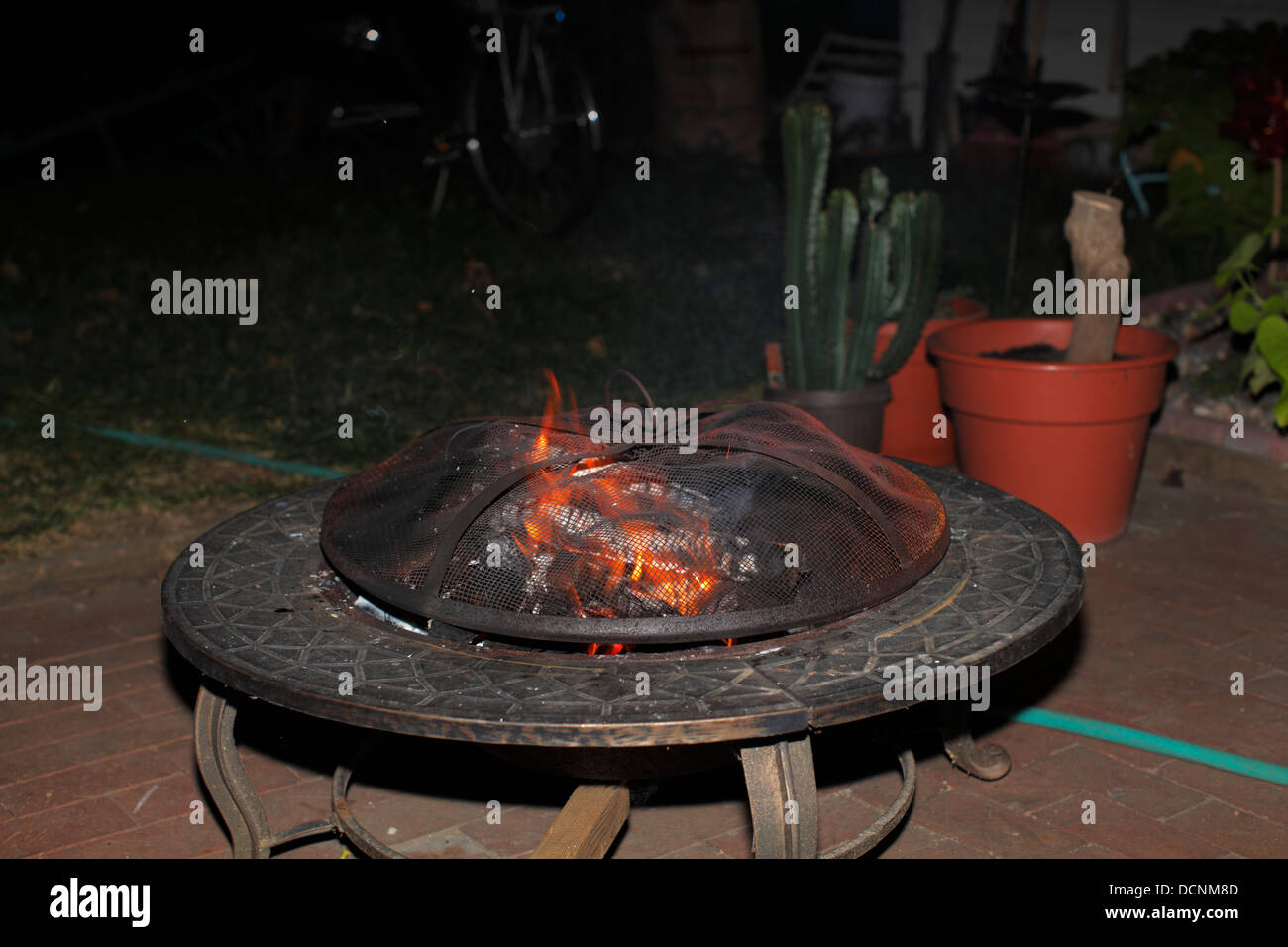 Outdoor fire pit at night Stock Photo Alamy