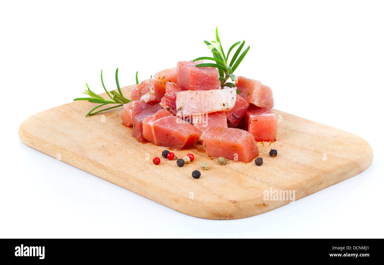 pieces of raw meat on a kitchen board, on a white background Stock ...