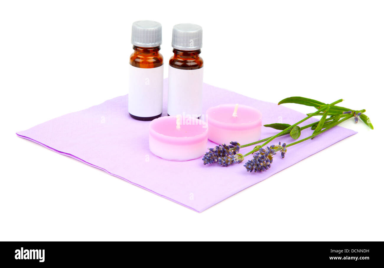 Lavender oil, candle and lavender flower, isolated on white back Stock Photo