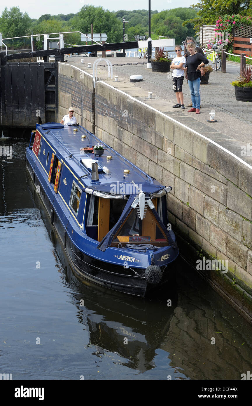 A canal narrowboat passing through Beeston canal Nottingham England uk