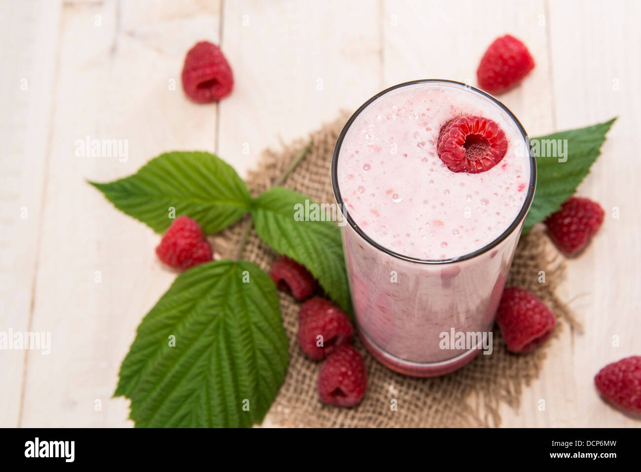Fresh made Raspberry Milkshake with fruits Stock Photo