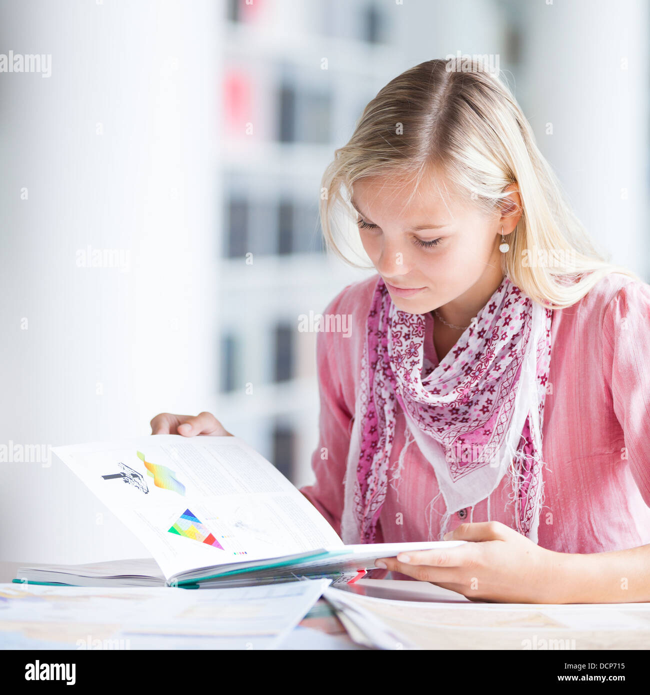 in the library - pretty female student with books Stock Photo - Alamy