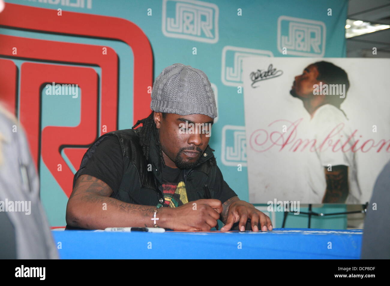 Wale signs copies of his album Ambition at at J&R Music World store New