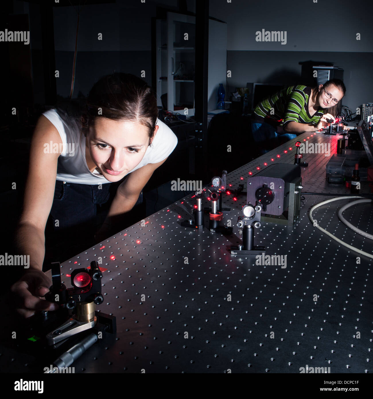 Female scientist doing research in a quantum optics lab Stock Photo