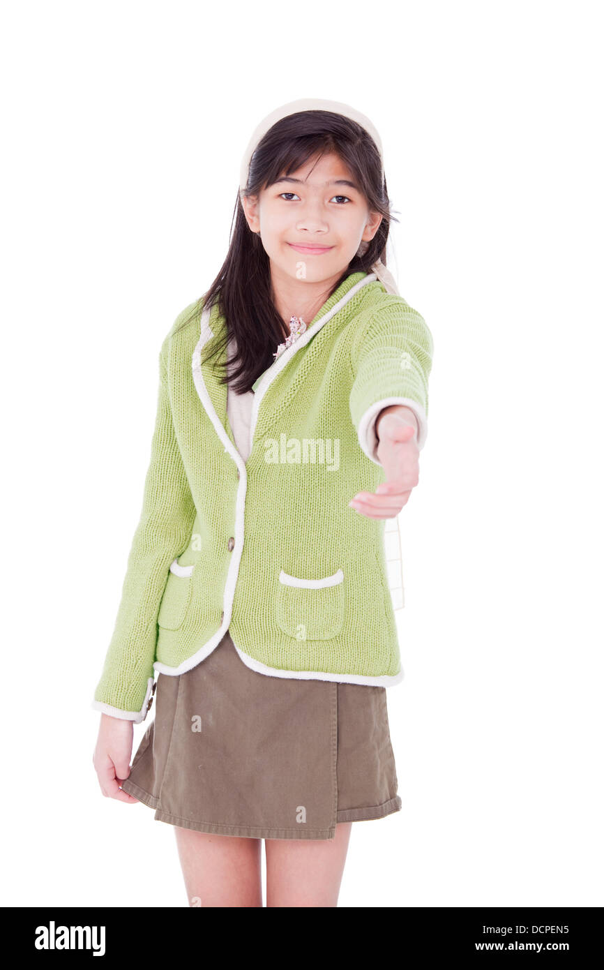 Girl in lime green sweater extending hand in greeting Stock Photo Alamy