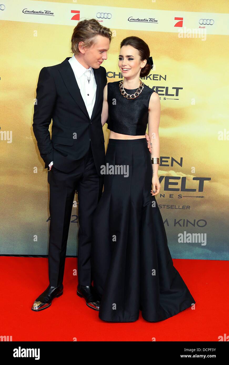 Berlin, Germany. 20th Aug, 2013. British actors Jamie Campbell Bower and Lily Collins attend to the premiere of their new movie 'The Mortal Instruments: City of Bones' at the Sony Center in Berlin, Germany, on August 20th, 2013. © dpa picture alliance/Alamy Live News Stock Photo