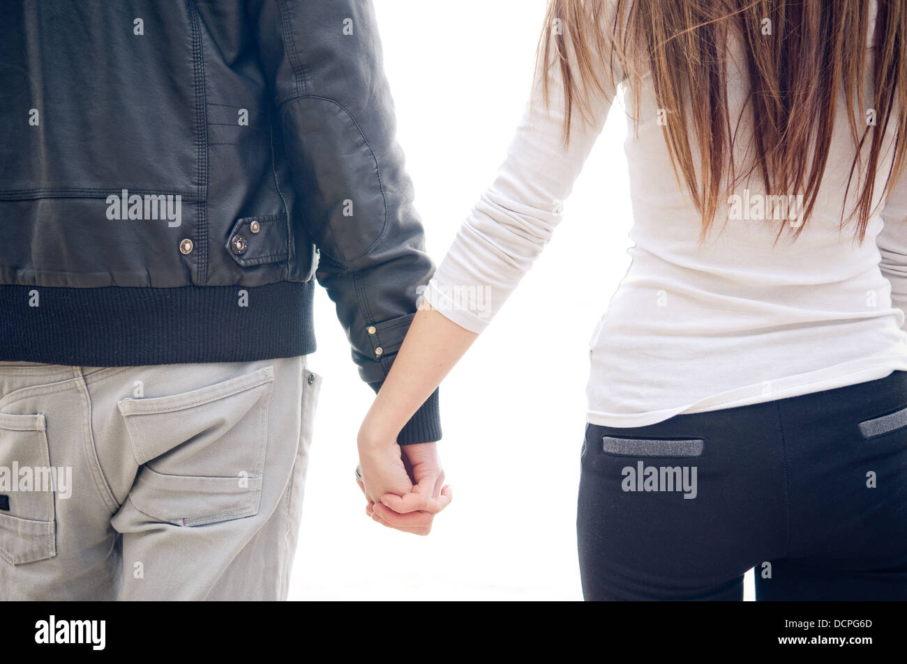 Teen couple walking holding hands hi-res stock photography and images ...