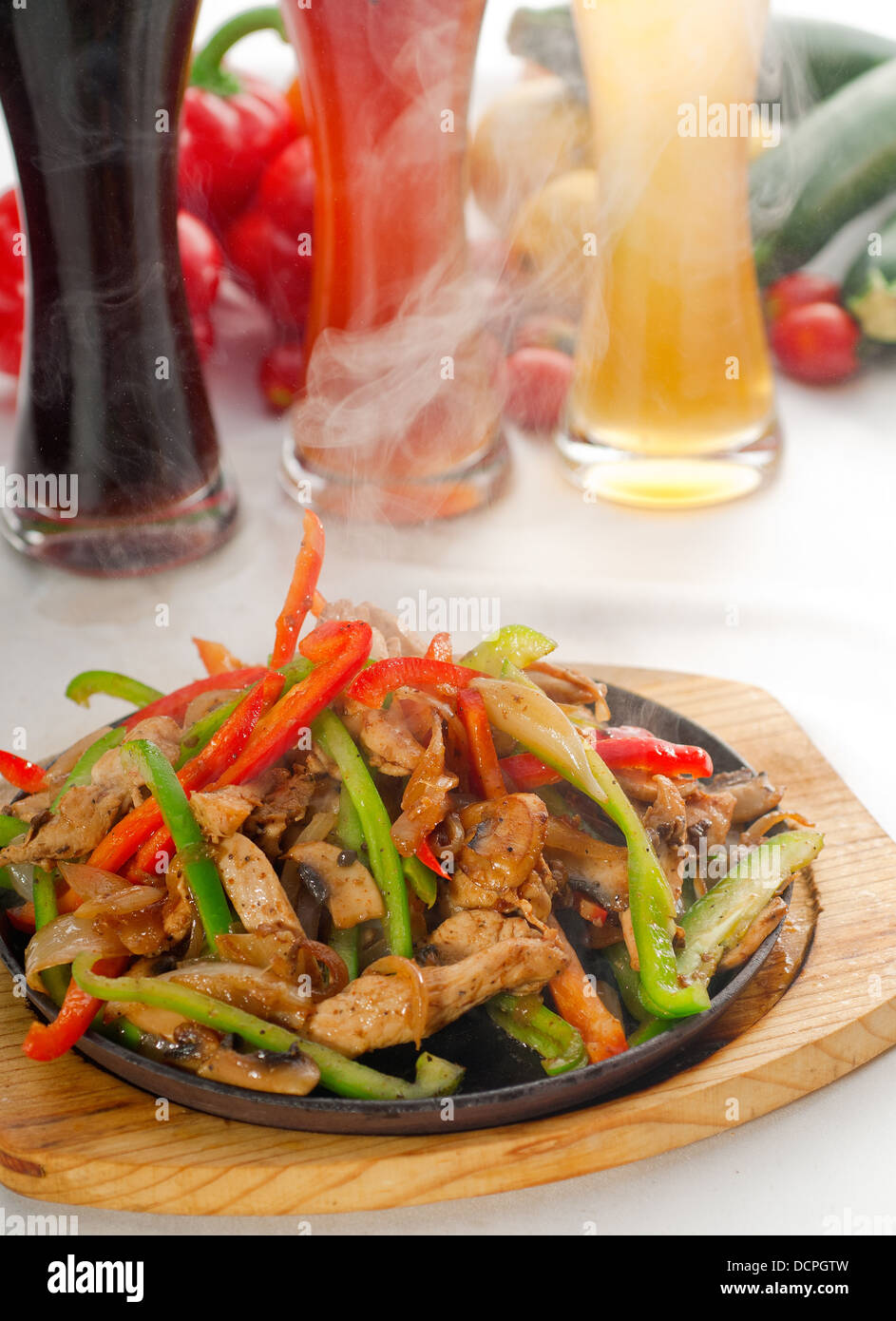 original fajita sizzling hot on iron plate Stock Photo Alamy