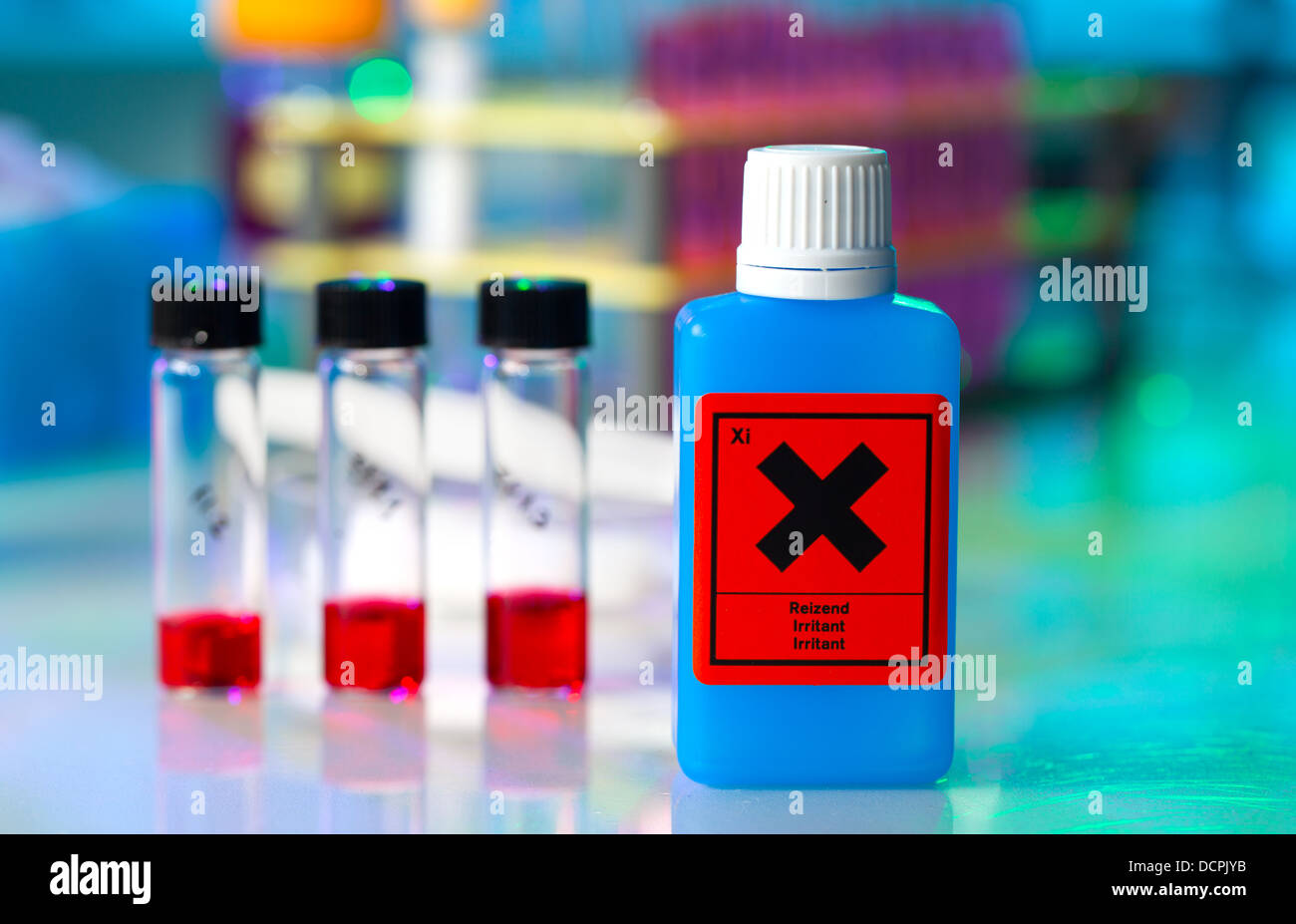 Dangerous substance in a plastic container on laboratory table Stock