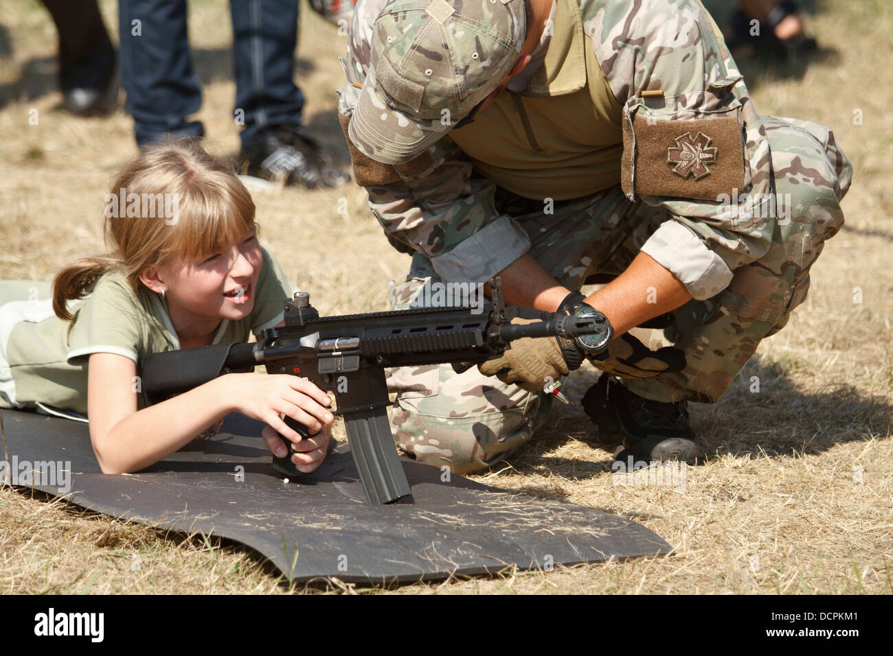 Shotgun instruction to a child during air show picnic in Katowice, Poland. Stock Photo