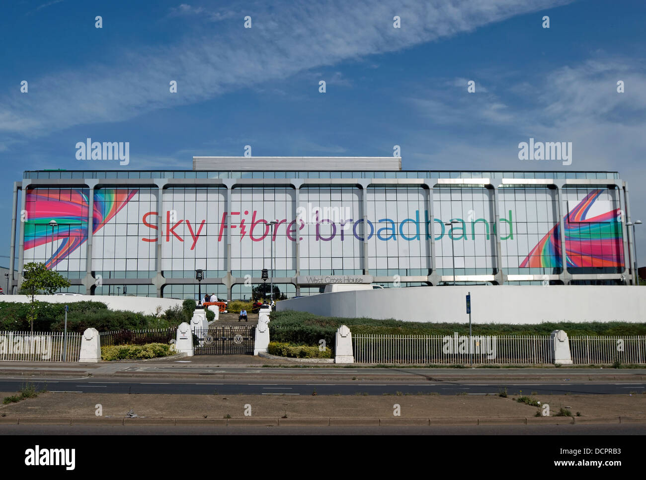 its frontage carrying an advert for sky fibre broadband, a building forming part of the sky tv complex in brentford, england Stock Photo