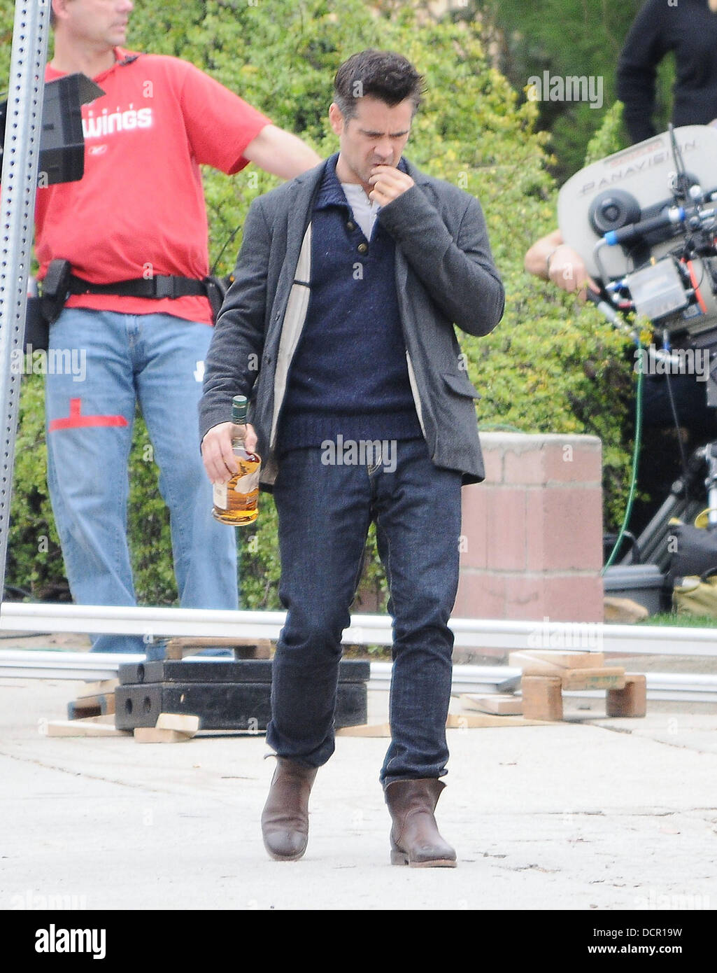 Irish actor, Colin Farrell looks inebriated as he drinks from a bottle of Buffalo Trace Kentucky Straight Bourbon Whiskey, as he films a scene of new movie 'Seven Psychopaths', a film about a man who gets involved in a friend's dog-napping plot. Los Angel Stock Photo