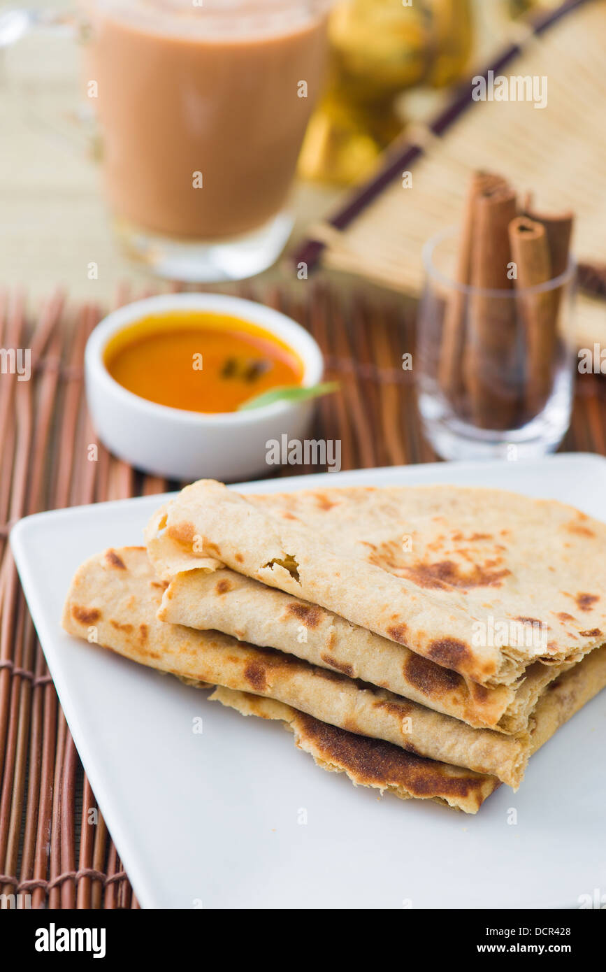 Indian flatbread called chapati on plate Stock Photo Alamy