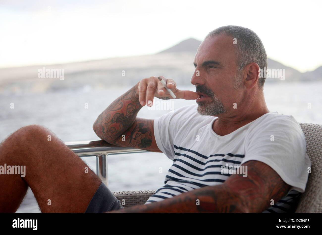 CHRISTIAN AUDIGIER Photograph of Christian in Jeans Smoking a Cigarette 