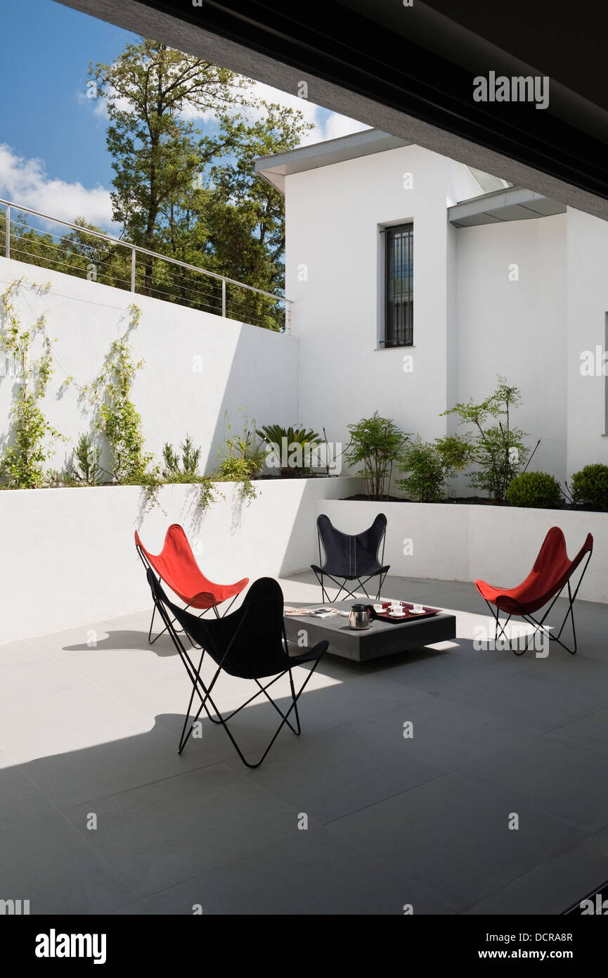 Sunlit terrace of holiday home in Provence, designed and built by David ...