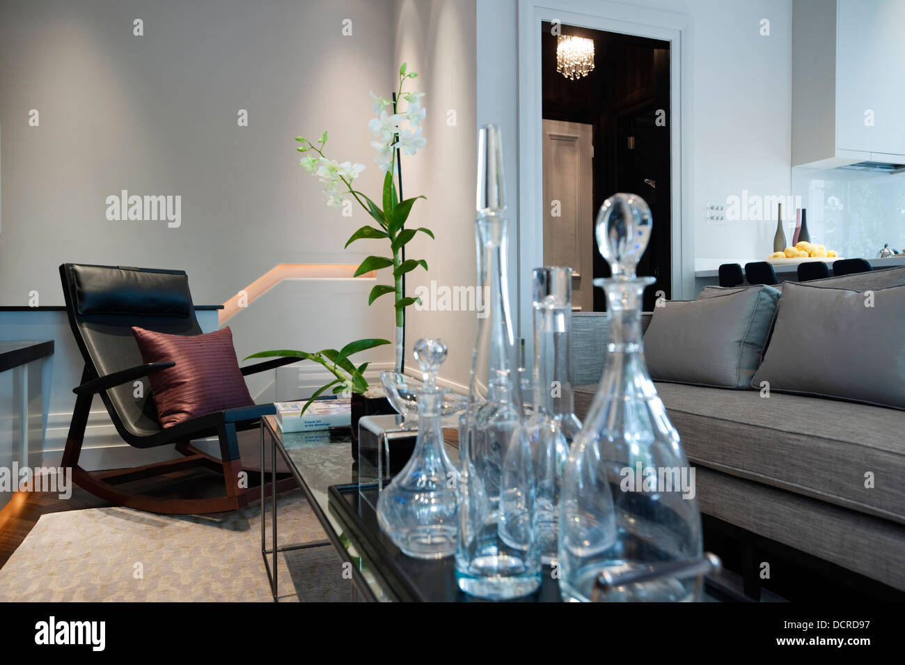 Seating area with glass decanters in London city apartment Stock Photo