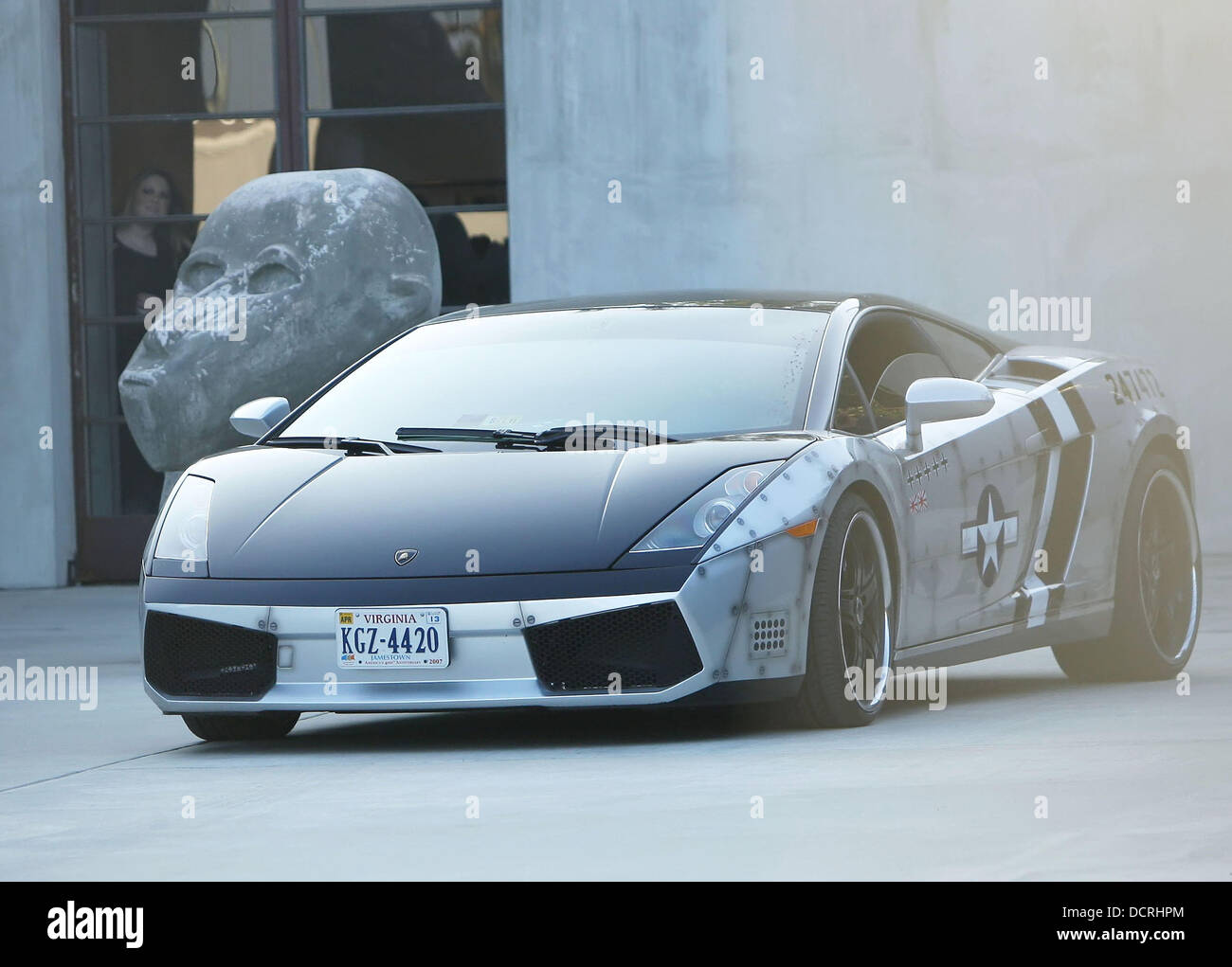 Chris Brown waits in his customized Lamborghini Gallardo for his girlfriend  Karrueche Tran who was shopping at nearby Maxfield West Hollywood,  California  Stock Photo - Alamy