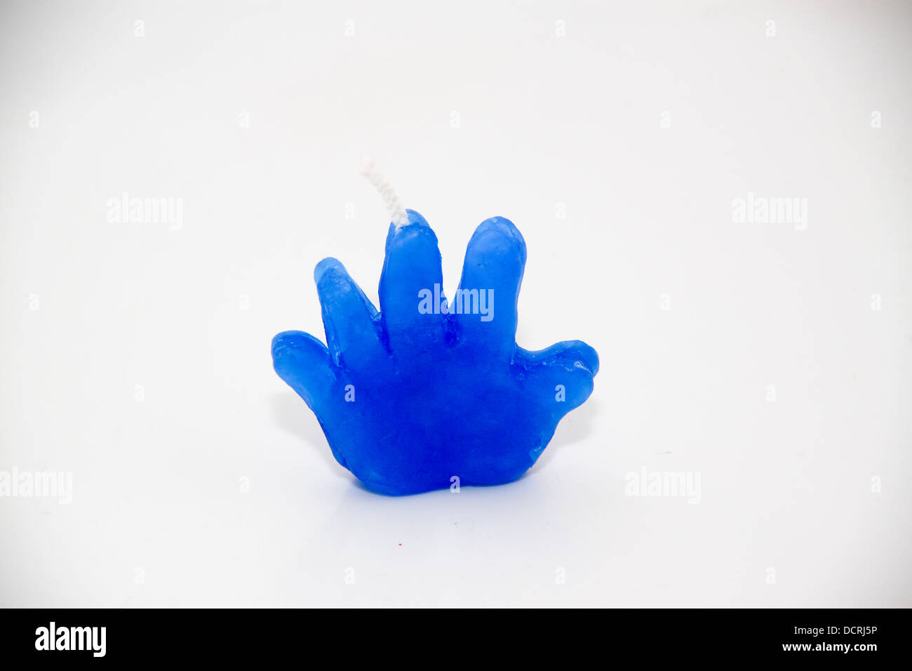 Small novelty hand made candle in hand shape Stock Photo Alamy