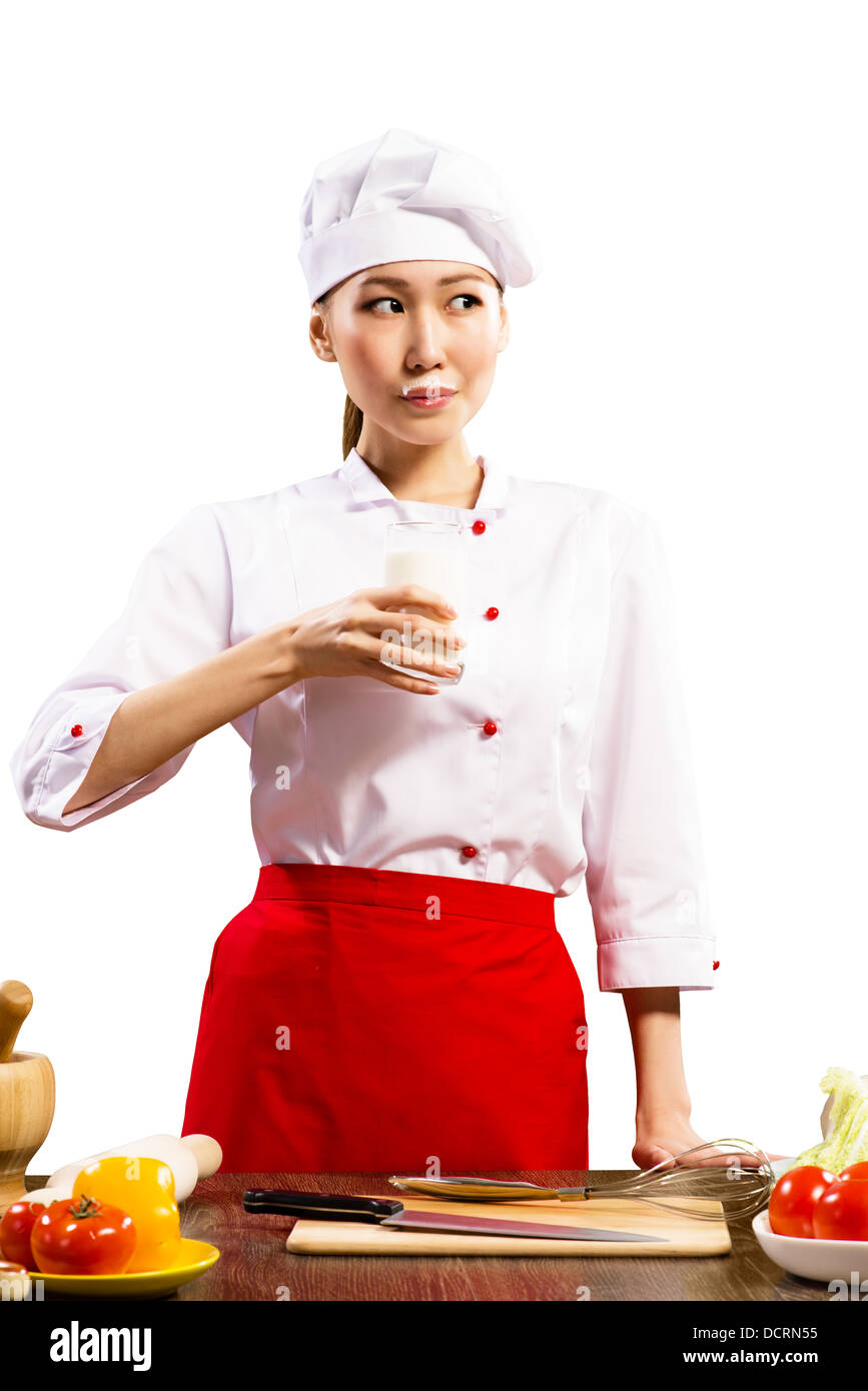 Asian female cook drinking milk Stock Photo