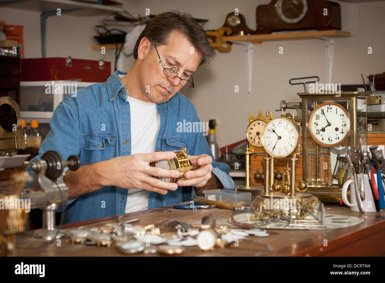 A Clock Maker And Repairman; St. Catharines, Ontario, Canada Stock Photo