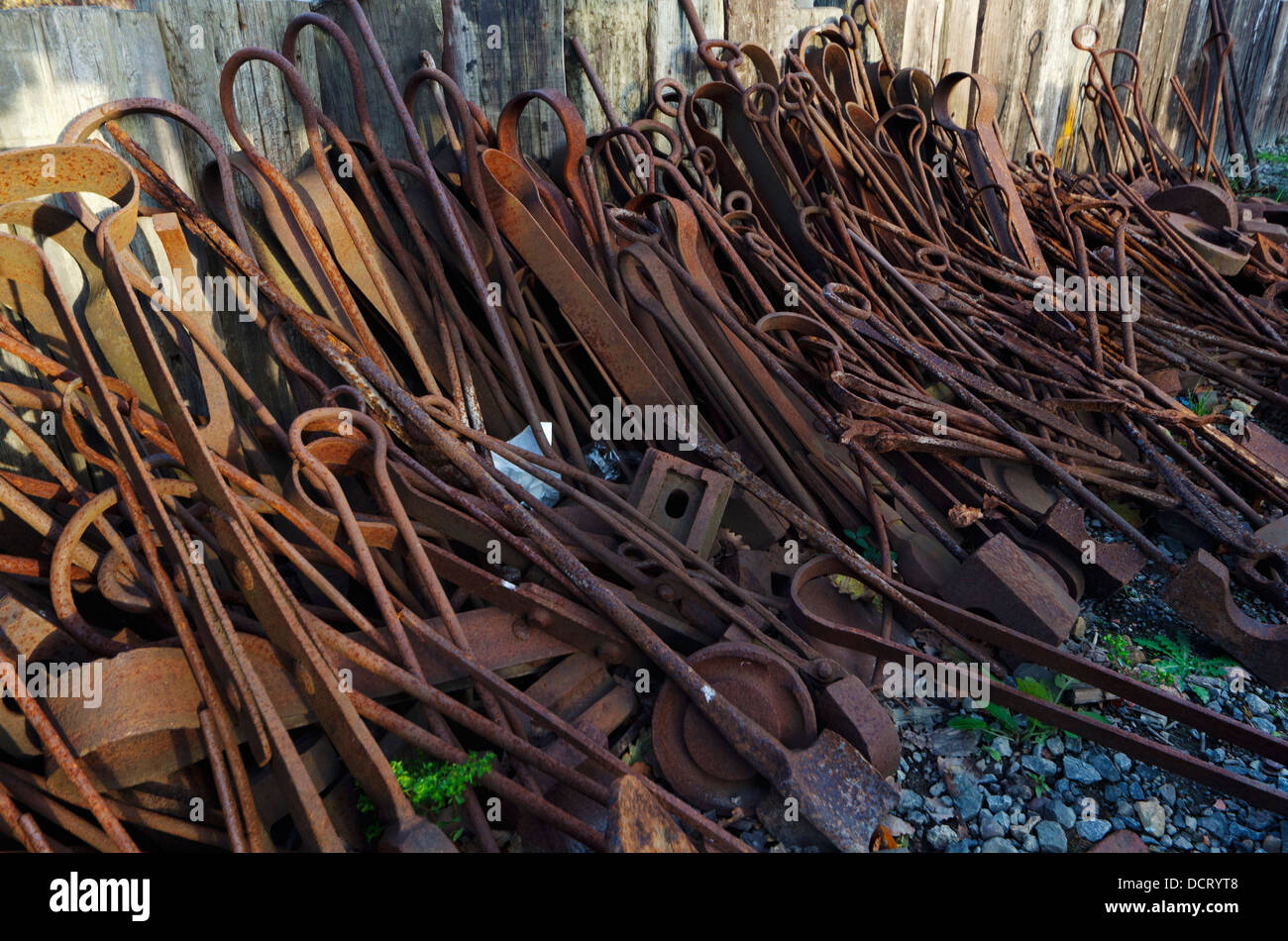 Old, Rusted Metal Pieces Leaning On The Exterior Wall Of A Building ...