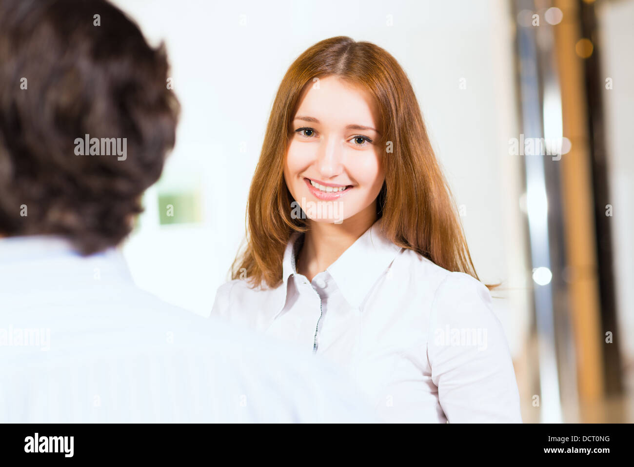 Attractive woman talking with a man Stock Photo
